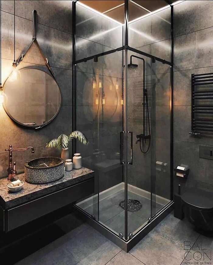 A bathroom with a large tub in the middle of the room and two sinks and two sinks on the wall next to a bathtub in front of a large window that has a wooden stool in a window